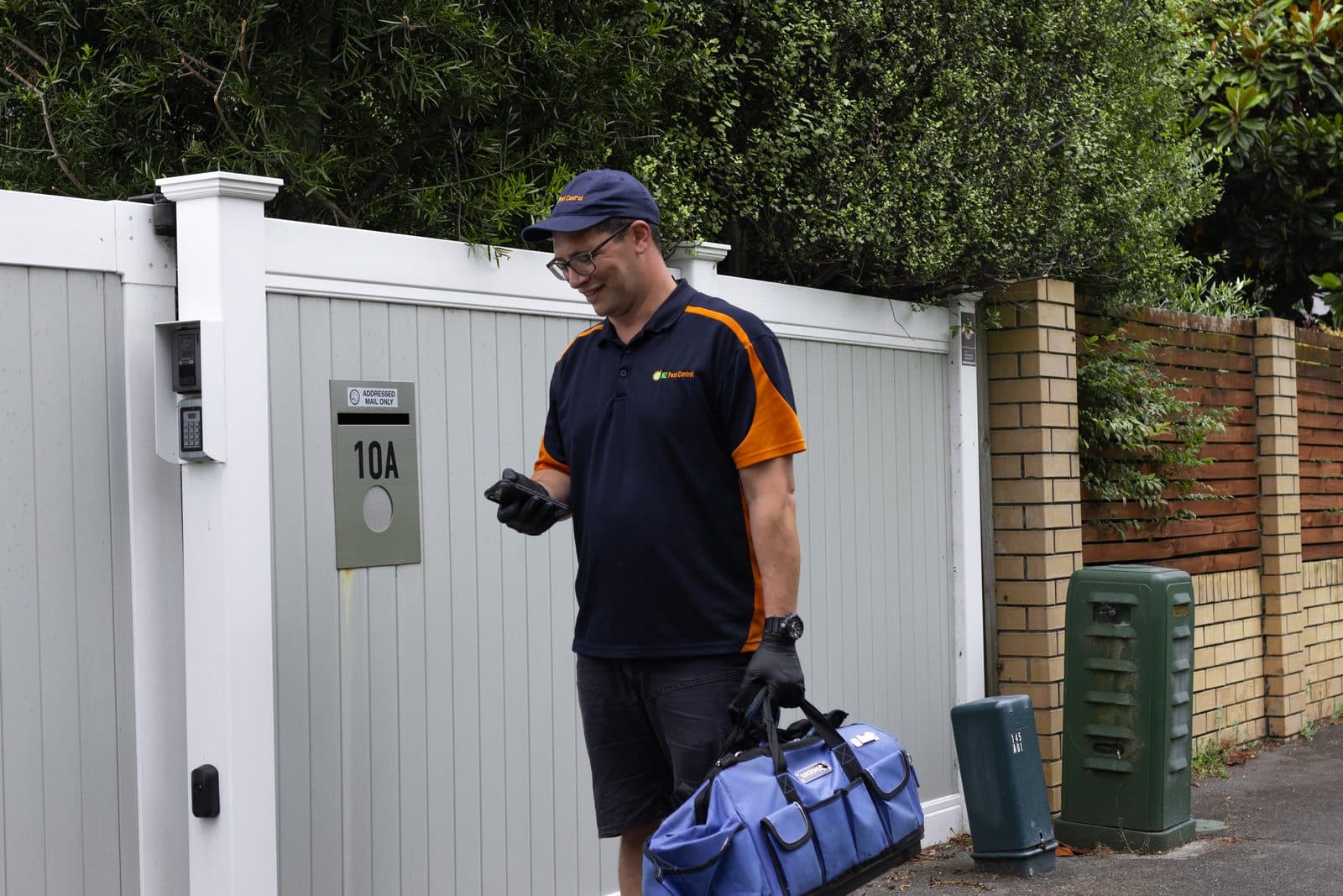 An NZ Pest Control technician arriving at an Auckland property